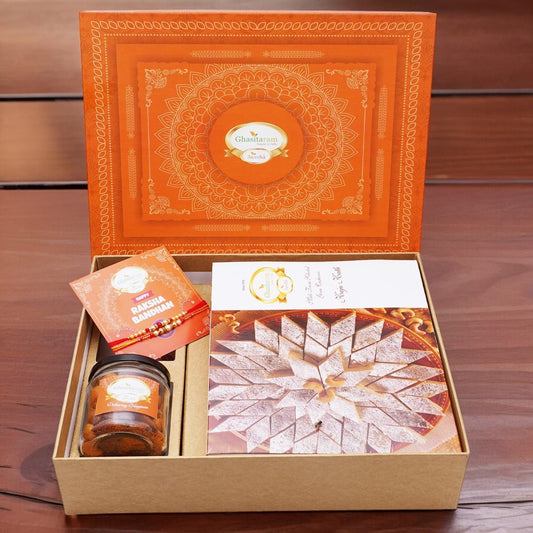 "Orange Delight Rakhi Gift Box with Sweets, Rakhis, and Dry Fruits - Perfect Gift for Brothers" - Nourishment Tapestry